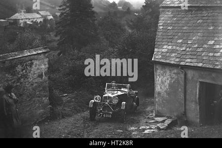 1932 Wolseley Hornet di N Tracey competere nel CCM Lynton Trial, 1932. Artista: Bill Brunell. Foto Stock