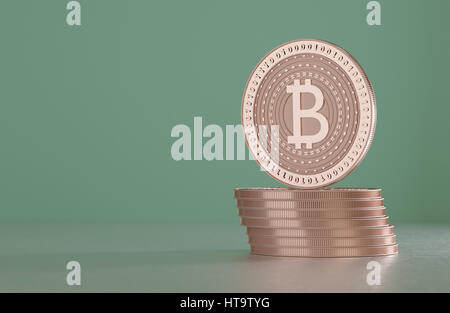Pila di rame bitcoins come esempio per la tecnologia blockchain davanti a sfondo sfocato Foto Stock
