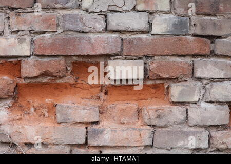 Natursteinmauer mit rotem Sandstein Foto Stock