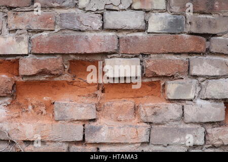 Natursteinmauer mit rotem Sandstein Foto Stock