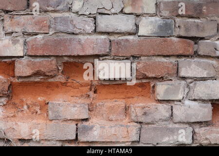 Natursteinmauer mit rotem Sandstein Foto Stock