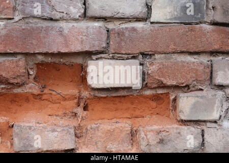 Natursteinmauer mit rotem Sandstein Foto Stock