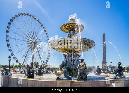 Francia, Parigi, la fontana dei Fiumi a Place de la Concorde, contro lo sfondo della grande giostra ruota Feries e l'obelisco di Luxor Foto Stock