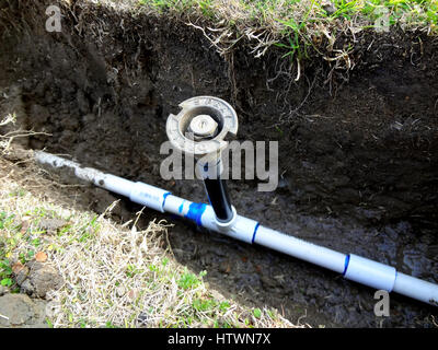 Sprinkler esposta in trincea aperta Foto Stock