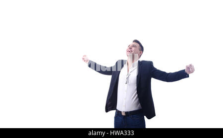 Giovani Happy business man celebra il successo con bracci studioshot outstreched Foto Stock