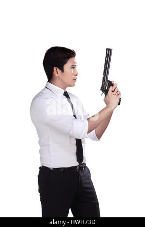 Ritratto di srcret agente che tiene una pistola isolate su uno sfondo bianco Foto Stock