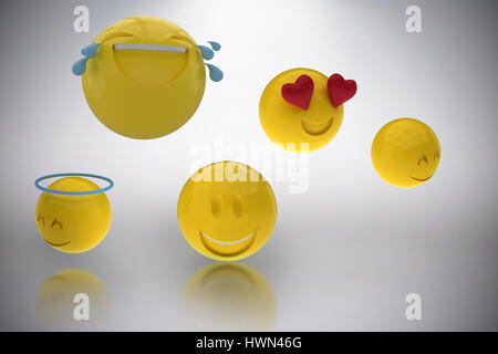 Immagine tridimensionale di faccine sorridenti contro uno sfondo grigio 3d Foto Stock