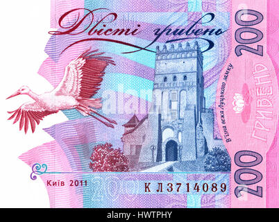 Frammento nota banca 200 ucraino grivna con l immagine di Lutsk Castello e slanciata gru Foto Stock
