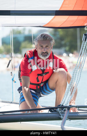 Professional training waterman sul lago con il catamarano Foto Stock