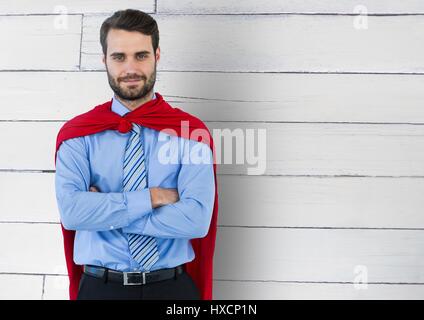 Composito Digitale del supereroe di Business contro il legno Foto Stock