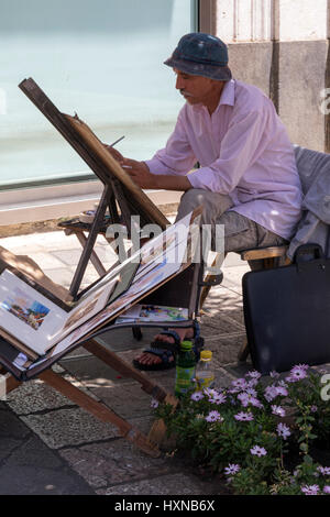 L'artista di strada al lavoro di Taormina, Sicilia Foto Stock