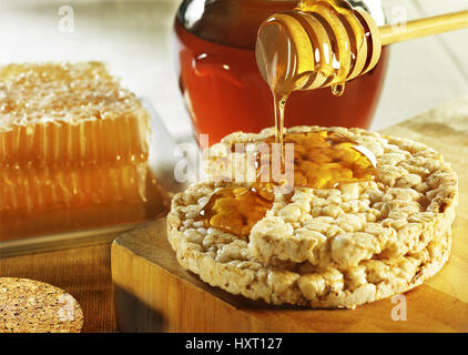 Frittelle di riso con miele Foto Stock