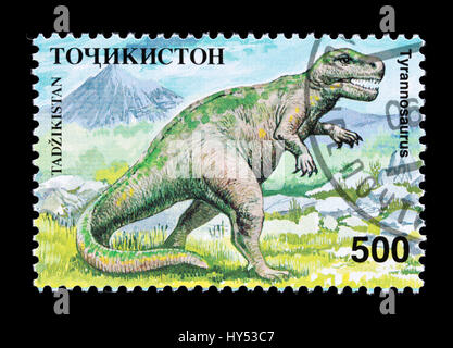 Francobollo dal Tagikistan raffigurante un tirannosauro dinosauro Foto Stock