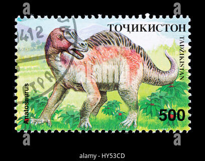 Francobollo dal Tagikistan raffigurante un dinosauro anatosaurus Foto Stock