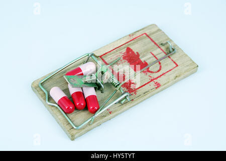 Pillole di medici in un mousetrap. Foto Stock