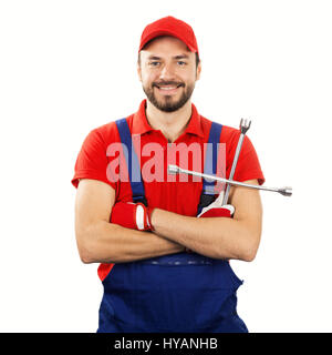 Auto meccanico con chiave isolati su sfondo bianco Foto Stock