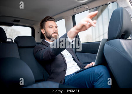 Imprenditore in auto Foto Stock