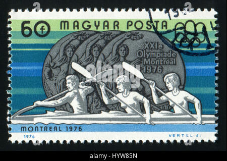 Ungheria - Circa 1976 un timbro stampato in Ungheria mostra di canottaggio e medaglia olimpica con la scritta Montreal, circa 1976 Foto Stock