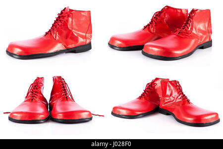 Red scarpe clown su sfondo bianco Foto Stock