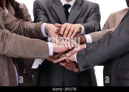 Un gruppo di persone di affari di mettere le mani sulla parte superiore di ogni altri Foto Stock