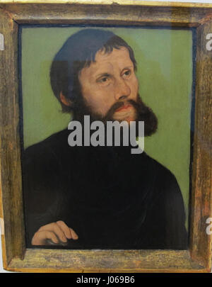 Questo ritratto del 1521 di Lucas Cranach il Vecchio raffigura Martin Lutero nei panni di Junker Jörg, mostrando la trasformazione di Lutero in una figura chiave della riforma protestante. Foto Stock