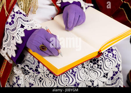 Sinterklaas con libro.Dettagli. Carattere olandese di Babbo Natale Foto Stock