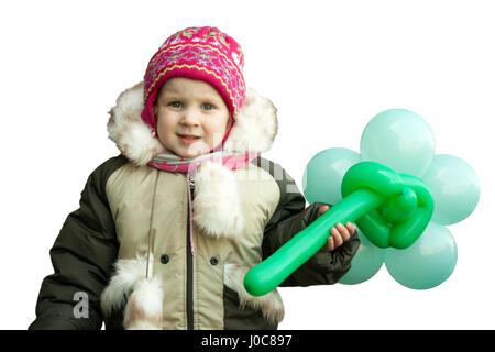 Bambina in abbigliamento invernale cercando triste. Foto Stock