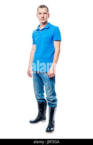 Agricoltore in stivali di gomma e jeans in pieno lunghezza su sfondo bianco Foto Stock