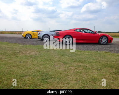 Tre Super Sars - Rosso Ferrari 488, argento Lamborghini Murcielago, giallo Lamborghini Murcielago Foto Stock