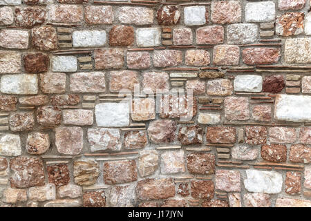 Muro di pietra sullo sfondo Foto Stock