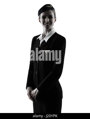 Una hostess caucasica equipaggio di cabina donna in piedi isolato su sfondo bianco in silhouette Foto Stock