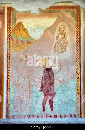 I religiosi pitture murali raffiguranti la vita di San Antonio Abate di Dionisio Baschenis ( circa 1493) sull'esterno della chiesa gotica di San Antonio Abate, Foto Stock