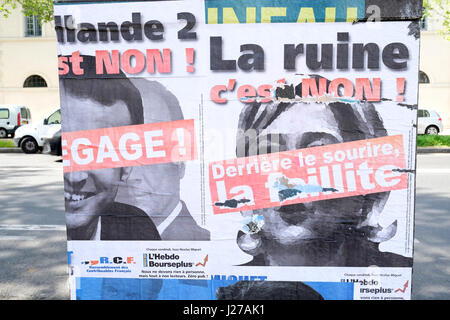 Manifesti di strada del 2017 elezioni presidenziali candidati Marine Le Pen e Emmanuel Macron Foto Stock