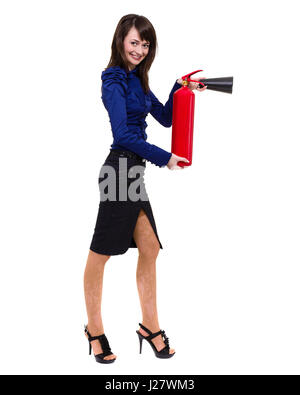 Giovane imprenditrice usando un estintore Foto Stock