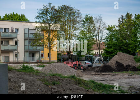 Due escavatore parcheggiata sul sito in costruzione Foto Stock