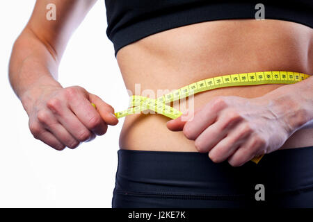 Montare la donna cintura di misurazione Foto Stock