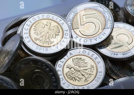 Una composizione di lucidatura delle monete in valuta Foto Stock