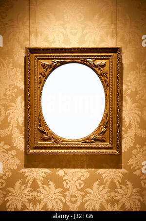 Golden vintage telaio su una carta da parati floreale Foto Stock