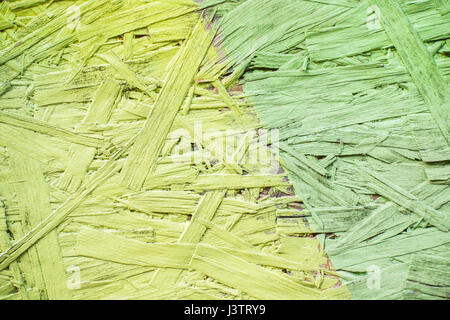 Verde e verde dipinto di legno truciolare sfondo texture. close up Foto Stock