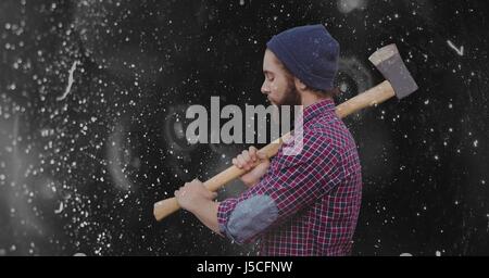 Composito Digitale della vista laterale del hipster holding ax Foto Stock