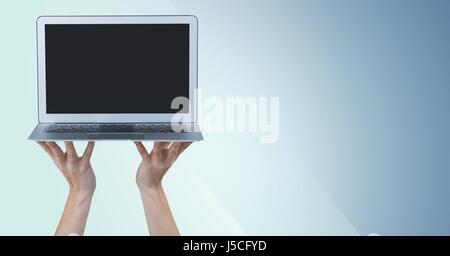 Digital composito di mani laptop contro sfondo blu Foto Stock