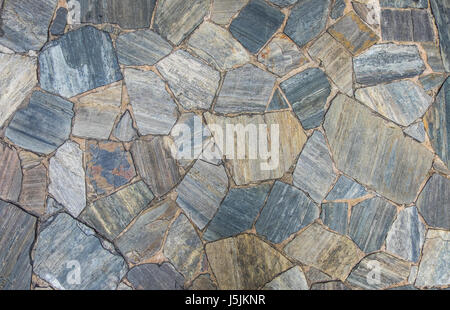 Pietra ardesia a pavimento e a parete texture in dimensione casuale sfondo pattern. Foto Stock