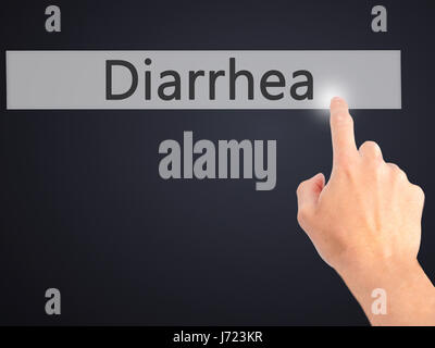 Diarrea - Mano premendo un pulsante sul fondo sfocato concetto . Business, tecnologia internet concetto. Stock Photo Foto Stock