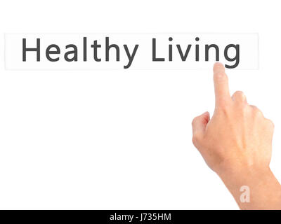Uno stile di vita sano - Mano premendo un pulsante sul fondo sfocato concetto . Business, tecnologia internet concetto. Stock Photo Foto Stock