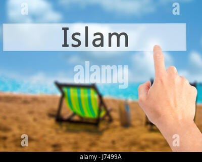 L'Islam - Mano premendo un pulsante sul fondo sfocato concetto . Business, tecnologia internet concetto. Stock Photo Foto Stock