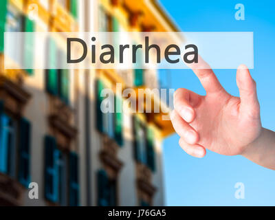 Diarrea - Mano premendo un pulsante sul fondo sfocato concetto . Business, tecnologia internet concetto. Stock Photo Foto Stock