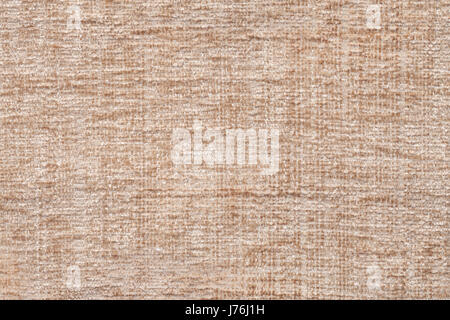 Marrone chiaro fluffy sullo sfondo di un morbido panno morbido. La texture di beige fuzzy closeup tessili. Foto Stock
