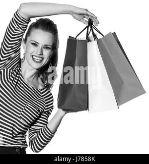 Shopping. Il modo francese. Ritratto di felice moda giovane-monger che mostra le borse per la spesa dei colori della bandiera francese isolati su sfondo bianco Foto Stock