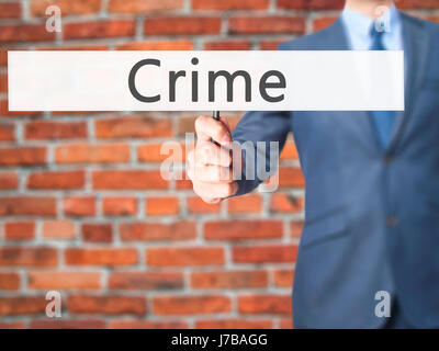 La criminalità - Business man mostra segno. Business, tecnologia internet concetto. Stock Photo Foto Stock