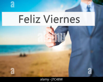 Feliz Viernes (Venerdì felice in spagnolo) - Imprenditore mano azienda segno. Business, tecnologia internet concetto. Stock Photo Foto Stock